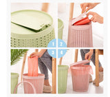 Image showing steps to use a portable garbage bag with box in pink and light green colors for easy waste disposal.