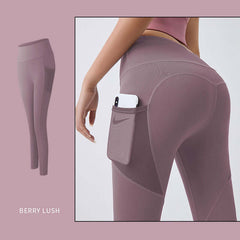 Woman's Pocket Yoga Leggings Tummy Control Fitness Pants in Berry Lush color with phone pocket.