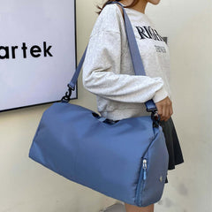 Womens Yoga Bag in blue color, being carried by a woman in casual attire.