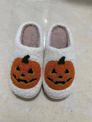 Halloween Pumpkin Cartoon Women's Shoes with vibrant pumpkin designs in a cozy slipper style, perfect for spooky season.