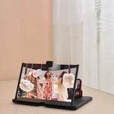 Mobile phone screen magnifier showcasing a vibrant video projection of people celebrating with balloons.