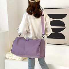 Womens Yoga Bag in purple color, featuring a shoulder strap, displayed on a woman wearing a casual outfit.