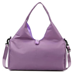 Womens Yoga Bag in purple with adjustable shoulder strap and dual carry options.