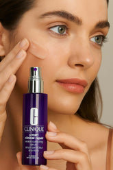 Clinique Smart Clinical Repair Wrinkle Correcting Serum applied on skin by model, showcasing skincare benefits.