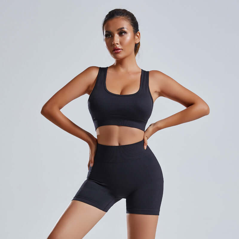 2pcs Womens Seamless Yoga & Workout Set in black worn by a model, showcasing a stylish and comfortable athletic outfit.