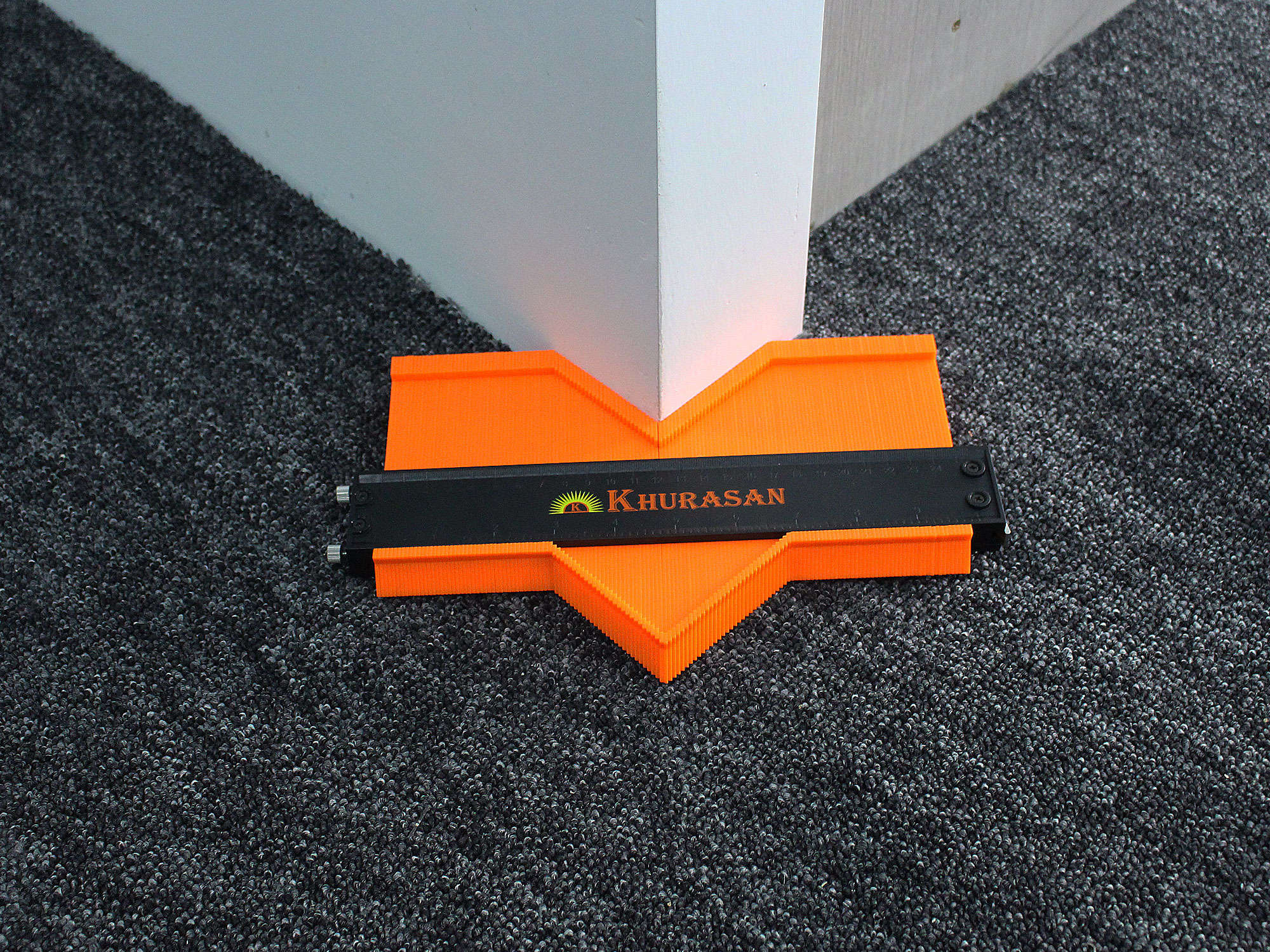 Contour gauge locked around corner post profile demonstrating accurate shape copying
