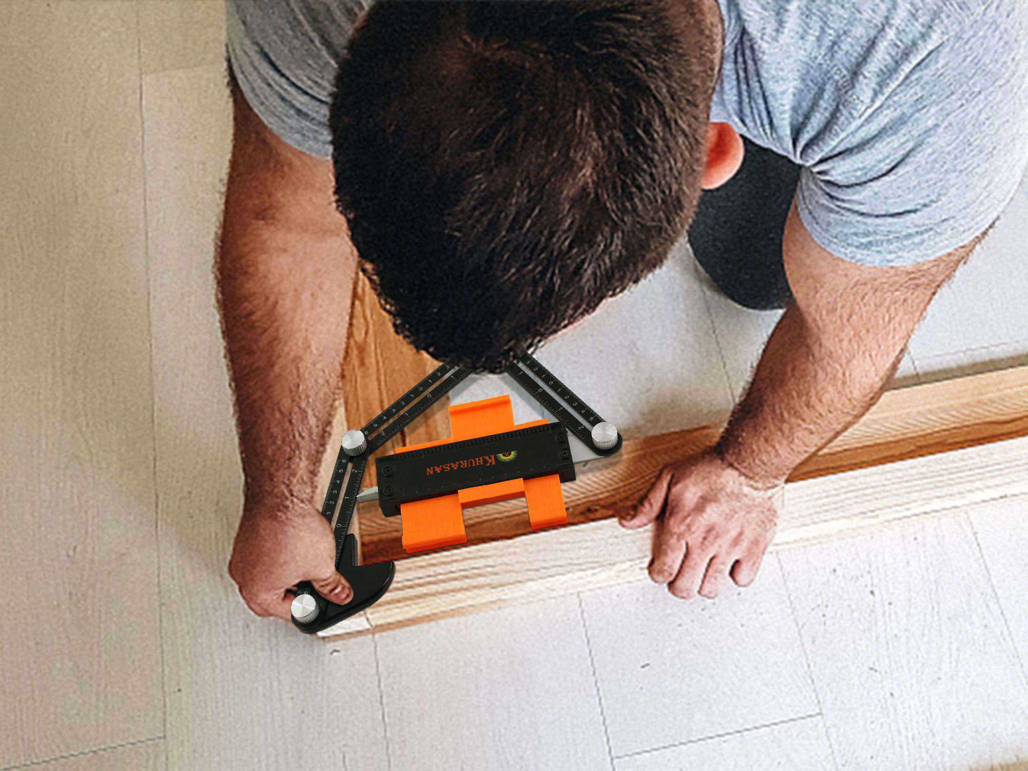 Craftsman using contour gauge and angle ruler to measure wood plank on tiled floor